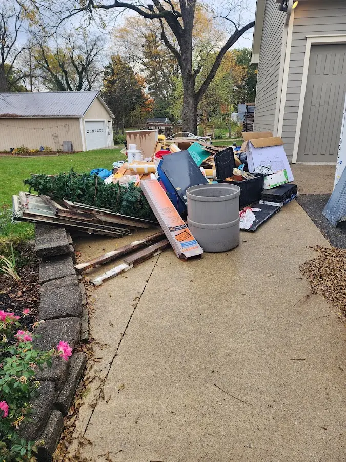 Dumpster being loaded with debris for Roofing Dumpster Rental in Shady Side
